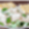 The chicken caesar salad includes seasoned chicken and parmesan cheese served on romaine lettuce topped with caesar dressing served with grilled parmesan bread.