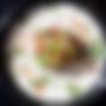 A 24 ounce bowl filled with white queso sauce, topped with cliantro and pico de gallo, and served with a 5 ounce portion of a meat of your choosing.