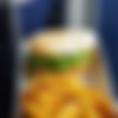 Personal sized mexican sandwhich with refried beans and guacamole then just add all your extra toppings