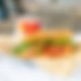 The California Club includes ham, turkey, bacon, avocado, cheddar cheese, tomato, arugula and mayonnaise served on your choice of bread..