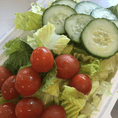Fresh romaine topped with cucumbers & tomatoes. Served with a side of papaya seed dressing.