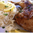 Split chicken marinated in Greek seasonings and braised till tender  and juicy